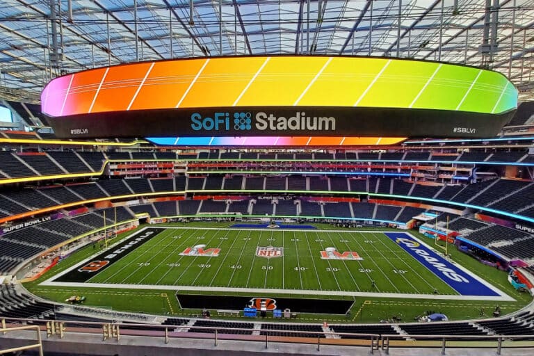 Inside SoFi Stadium in Los Angeles, showcasing its massive halo video board, NFL field, and cutting-edge design that exemplify the future of US sports and live entertainment construction.