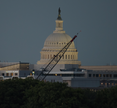 Shot of the Capitol dome with a crane in front of it