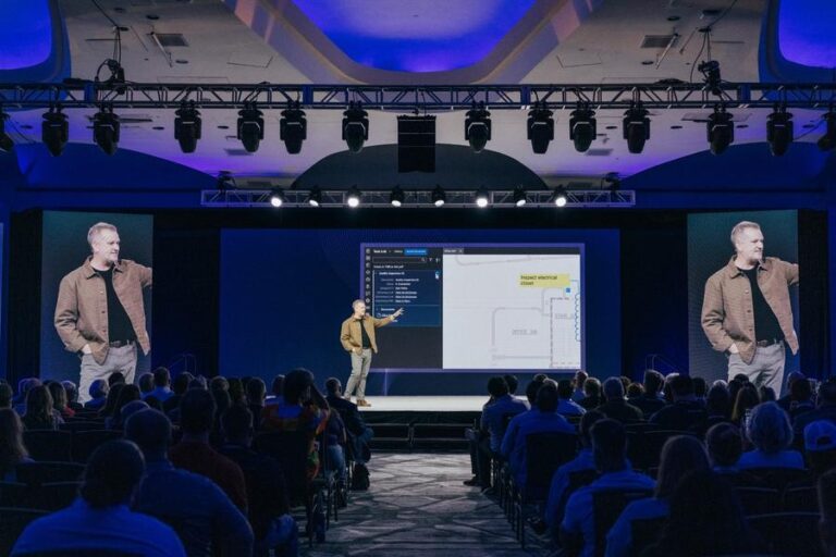 Bluebeam’s Luke Prescott presents new product innovations during the Unbound 2025 conference in Washington, D.C., showcasing workflow updates on stage before a full audience.