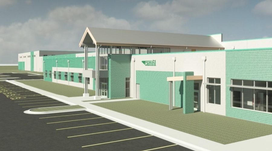 Architectural rendering of Camfil’s new flagship air filtration manufacturing facility in Texas, showcasing resilient design features, modern facade, and expanded parking space under a partly cloudy sky.