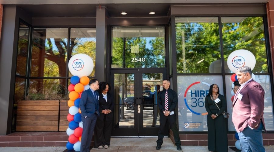 Hire360 leaders, contractors and partners gather outside the Chicago nonprofit’s training center, highlighting workforce development and support for small construction businesses.