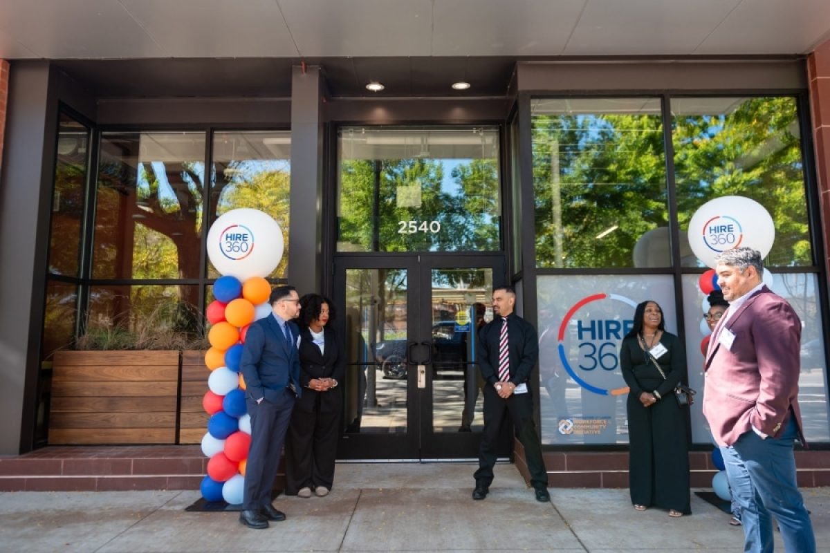 Hire360 leaders, contractors and partners gather outside the Chicago nonprofit’s training center, highlighting workforce development and support for small construction businesses.