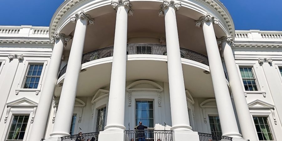 The White House South Portico on a sunny day, symbolizing U.S. federal leadership—relevant to discussions on modernizing permitting processes using AEC-specific digital tools.